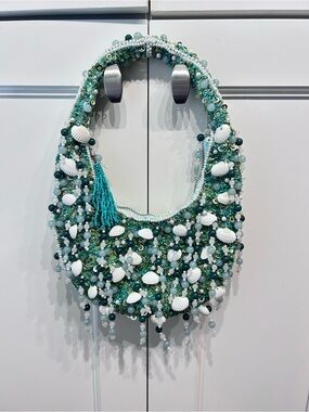 Viral seashell beaded bag green tassel
